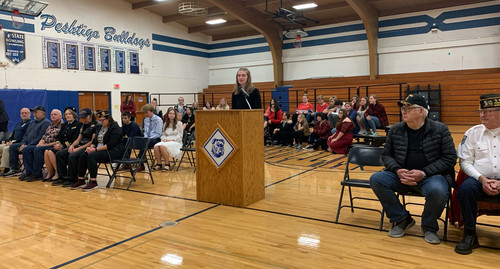 Senior Lauren Halfmann speaks during Veterans Day assembly