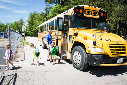 Students getting off bus at PELC